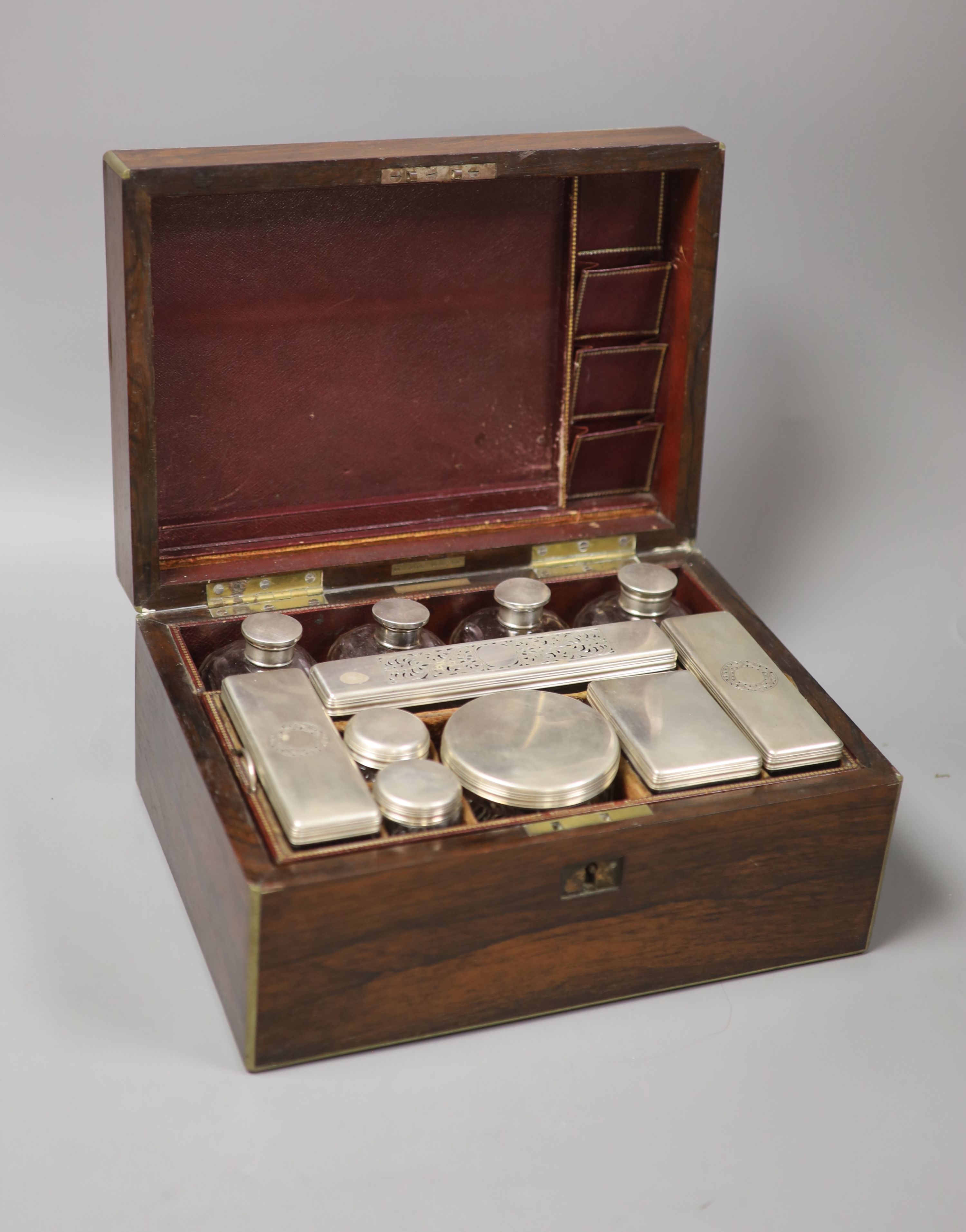 An early Victorian W.Lund brass bound rosewood toilet box with silver mounted fittings W. 29.5cm D.21cm H.14.5cm